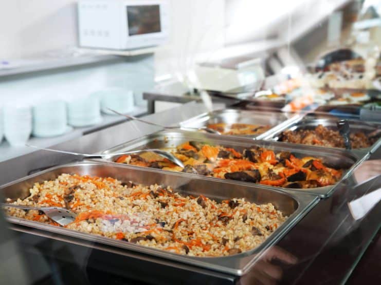 Containers with healthy food in school canteen